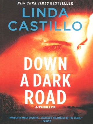 Item #15148 Down a Dark Road; a Kate Burkholder novel. Linda Castillo